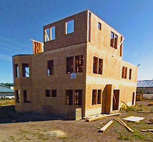 Job site showing wood framed building to the third floor waiting for roof trusses in Post Falls ID